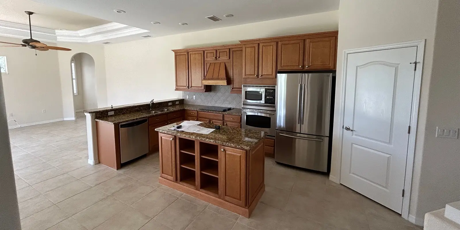 outdated kitchen with lots of storage options.