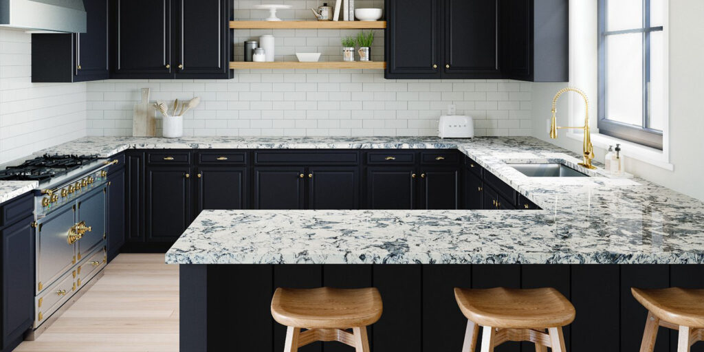 Contemporary kitchen with striking black cabinetry and a luxurious white marble countertop, creating a bold and elegant contrast. By Florida Design Works. Sarasota countertops. Naples countertops. Fort Myers countertops. Jacksonville countertops.