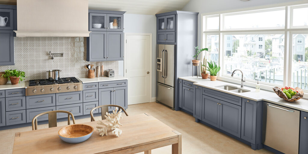 Modern kitchen with sleek grey cabinetry, clean lines, and a minimalist design for a contemporary, sophisticated look by Florida Design Works. Sarasota cabinets. Naples cabinets. Fort Myers cabinets. Custom cabinetry.
