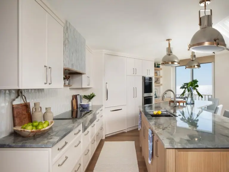 Luxurious Seaside Sanctuary kitchen design by Charles Design Studio in Naples, showcasing a tranquil and modern coastal-inspired remodel by Florida Design Works.