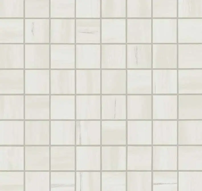 Close-up of white tiles in stock at Florida Design Works, showcasing their texture and unique patterns.