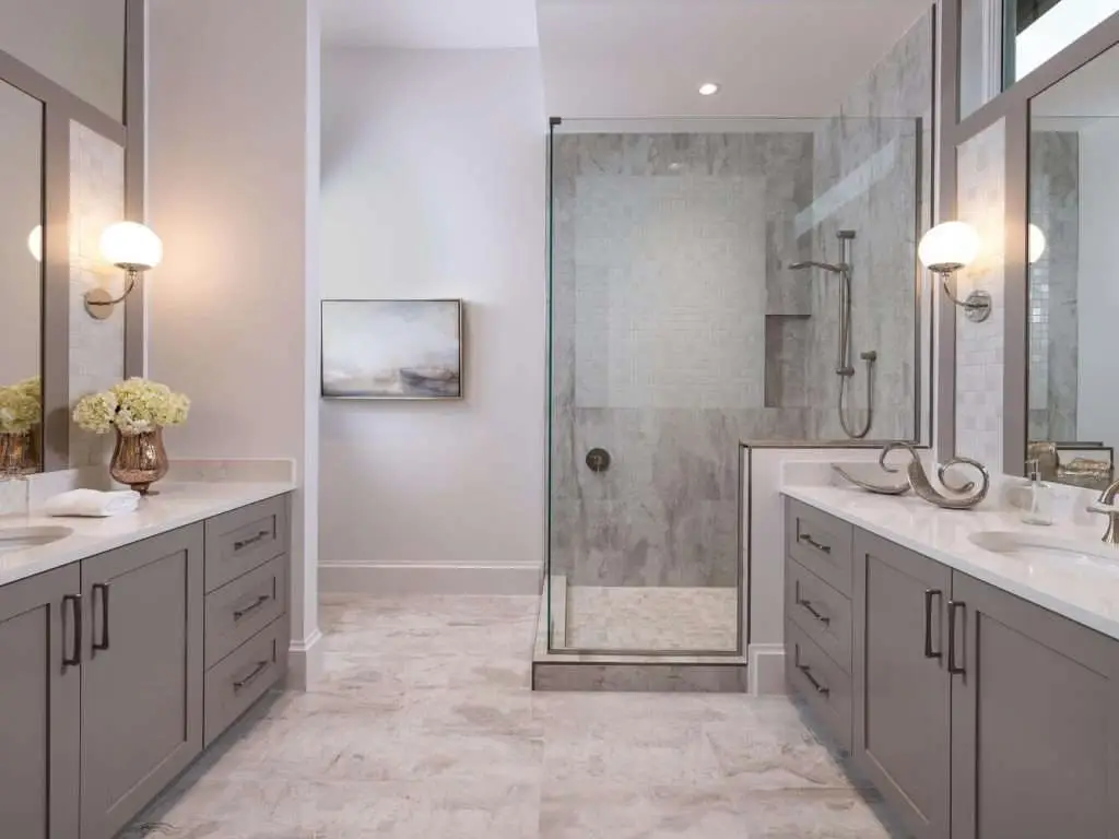 Bathroom featuring glass services and stunning countertops, showcasing the design excellence of Florida Design Works' portfolio.