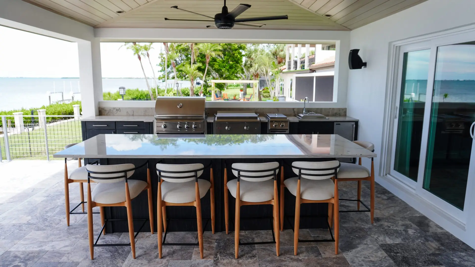 Dickens_Outdoor Kitchen_01 Functional outdoor kitchen by Florida Design Works, featuring clean lines and efficient use of space for a contemporary look.