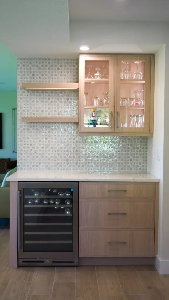 Custom dry bar installation in a Longboat Key apartment unit, designed by Florida Design Works to enhance entertaining space with sleek cabinetry and functional storage.