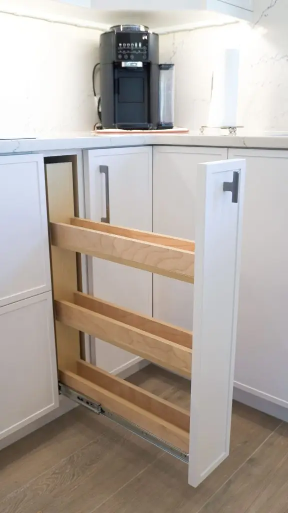 "Custom kitchen storage solution in a Longboat Key apartment unit, designed by Florida Design Works to maximize space and functionality as part of their recent renovation project.